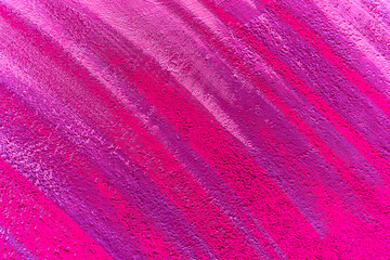 Colorful abstract brush strip drawing on the walls of the city. Striped pattern for wallpaper design. Beautiful bright colorful street art graffiti background.