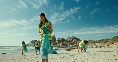 Beach, volunteer and cleaning with charity for eco friendly, sustainability and environment care in nature. Teamwork, pollution and people with garbage bags for waste, community service and earth day