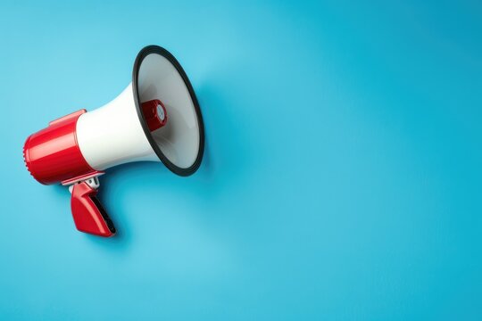 Loudspeaker white-red color on blue background with copy space. Loud Speaker on banner for sales and advertisements with empty place for text. Megaphone elements for collages in y2k style