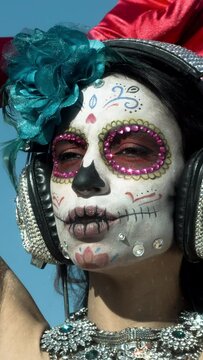 Woman with candy skull face make up vertical