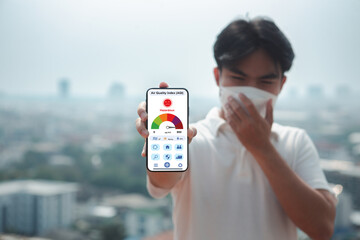 PM 2.5 affecting the respiratory tract, wear masks to protect against dust and smoke PM2.5. Application on smartphone screen the concentration of air pollutants the hazardous Air Quality Index (AQI).