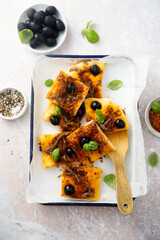 Traditional savory pie with anchovy and olives