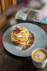 Homemade fluffy banana pancake with chocolate. Top view