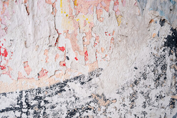 Old and dirty wall with scratched paint and peeled poster, abstract and messy collage background