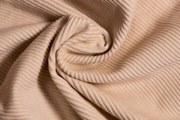 Velvety fabric texture pattern. Texture of velvet textile nude color.