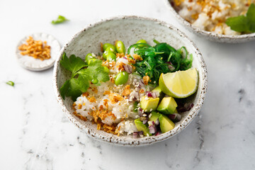 Healthy vegan poke with edamame beans and seaweed