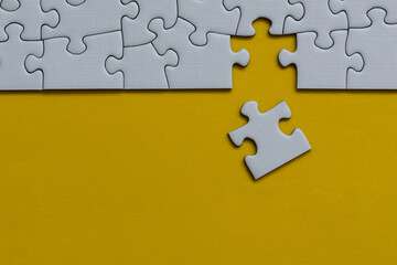 Fototapeta premium Finishing puzzle assemble with the last one - missing puzzle piece