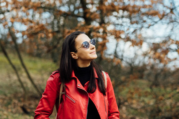 portrait of a woman in nature with sunglasses