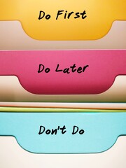 Document folders organizer with labels DO FIRST DO LATER DON'T DO, concept of time management...