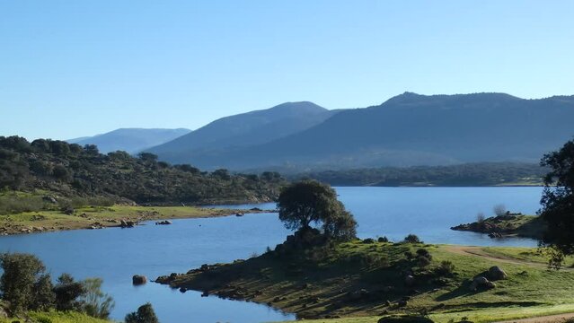 View of the Plasencia reservoir, relaxed landscape and the Jerte Valley in the background