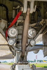 Fototapeta premium The front landing gear of the aircraft. Airplane detail. Plane wheel.