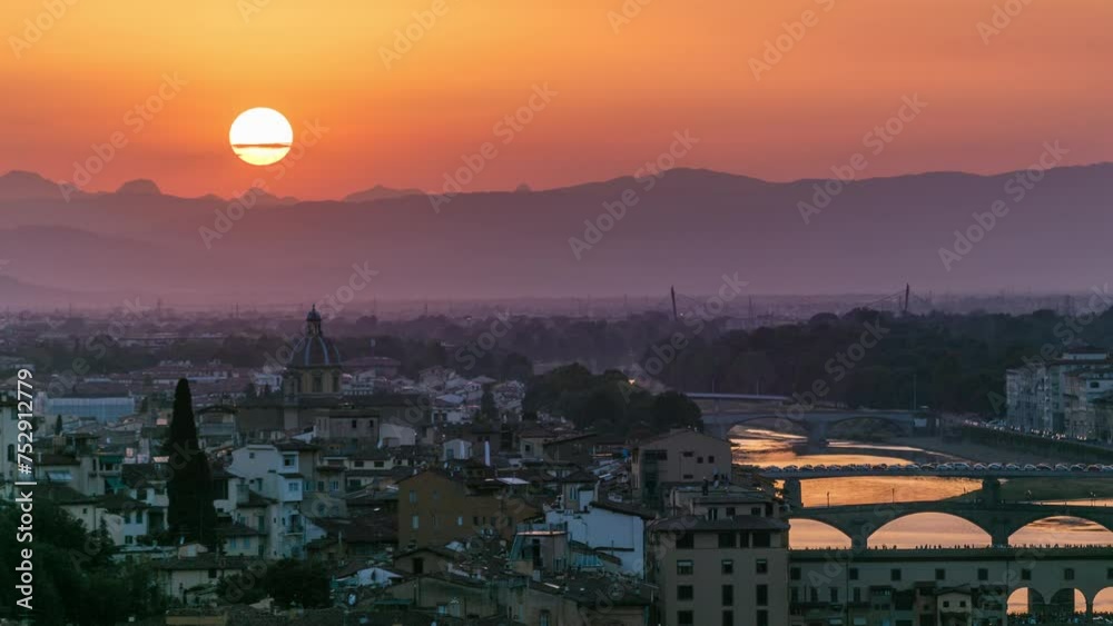 Wall mural Skyline view of Arno River aerial timelapse. Ponte Vecchio from Piazzale Michelangelo at Sunset, Florence, Italy. Orange sky. Evening mist