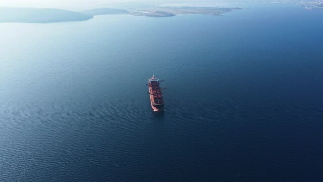 Dry bulk cargo carrier vessel anchored cleaning operation ship holds preparing for loading new dry cargo, aerial view