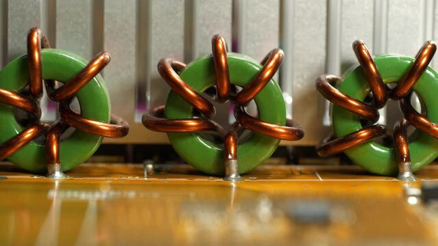 High current toroidal wound coils. Elements of personal computer motherboard. Toroidal wire wound coils high current magnetic inductor