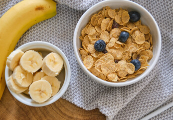 Smoothie bowl with banana, blackberries and muesli on wood table. Healthy eating, healthy lifestyle