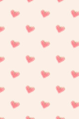 Pink heart made of beads pattern on a beige background. Creative concept.