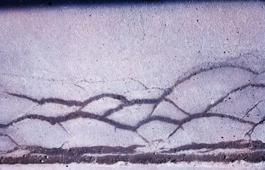 Cracked street asphalt texture background