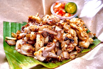 asian fresh wok fried bbq grilled seafood squid sotong with spicy onion chilli sambal sauce lime in banana leaf cafe hotel luxury halal vegan food restaurant banquet menu