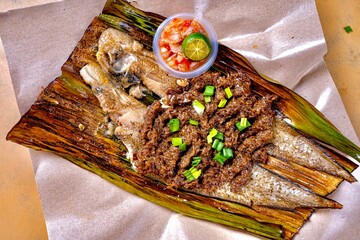 asian fresh wok fried bbq grilled seafood Saba fillet fish with spicy onion chilli sambal sauce lime in banana leaf cafe hotel luxury halal vegan food restaurant banquet menu