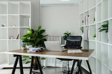 Office desk with office equipment provide fresh air environment, work area, and photocopying area