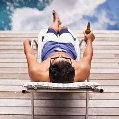 Man, relax and beer at pool in summer at hotel, resort or travel to luxury villa with peace in...