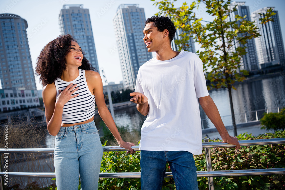 Sticker photo of charming cheerful married couple dressed casual outfits laughing enjoying weekend outdoors 