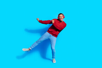 Photo of crazy positive active energetic man dj wear red stylish pullover dance club isolated on...