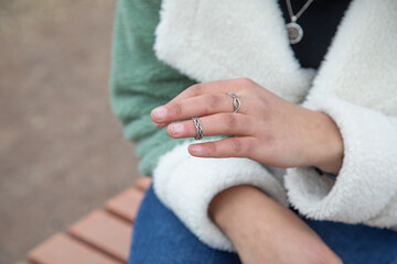 Caucasian young girl wearing beautiful ring.