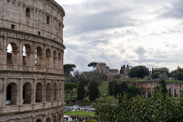 A large building with arched windows and a crowd of people in front of it