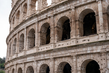 Fototapeta premium The arched entrance to a large building with a stone facade