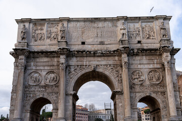 The archway is decorated with statues and has a lot of detail