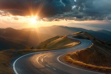 Curved mountain road at dusk with sunlight piercing through clouds