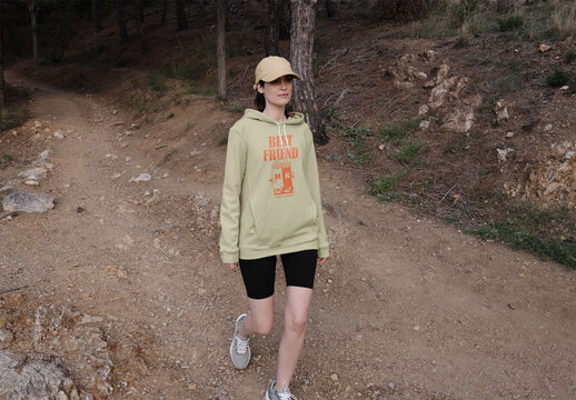 Mockup of woman wearing customized hoodie walking