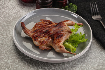 Grilled quail in the plate