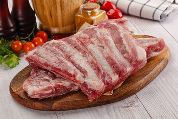 Raw pork ribs over board