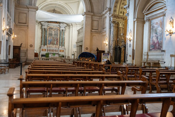 The church is empty and the pews are empty