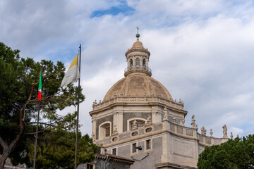 A large building with a dome on top and a flag on the roof