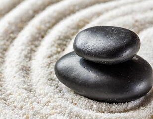 Zen garden stones on white sand with pattern