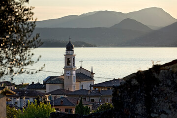 The village of Torri del Benaco with the church of San Pietro e Paolo. In the background Lake...