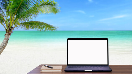 Laptop computer with blank screen with seascape background