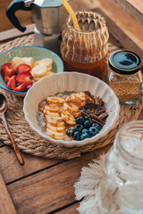 Oatmeal topped with fruit Chocolate and bee pollen