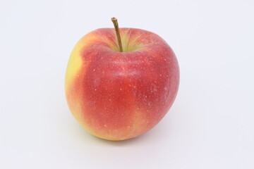 A very appetizing red apple is depicted on a light background.