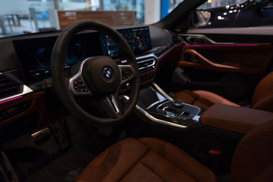 Interior, steering wheel, center console BMW i4 five-door electric liftback class D, German manufacturer BMW AG, Advanced technology in automotive industry, Frankfurt, Germany - January 22, 2024