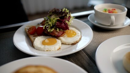 Fresh breakfast with scrambled eggs and orange juice in the hotel room. Scrambled eggs on the table in a hotel room.
