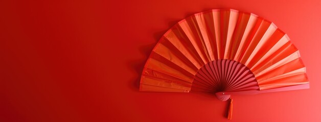 Traditional Japanese Red Hand Fan Isolated on Red - obrazy, fototapety, plakaty