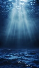 Split view of the sea above and below water surface with marine life and sunlight through waves