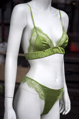 Closeup of green underwear on mannequin in a fashion store showroom - 753035530