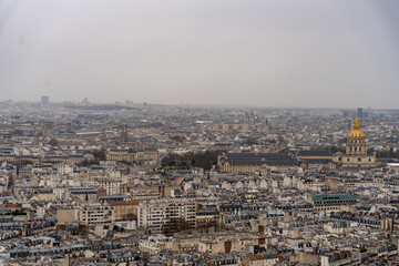 Fototapeta premium The city is full of tall buildings and a large dome in the distance