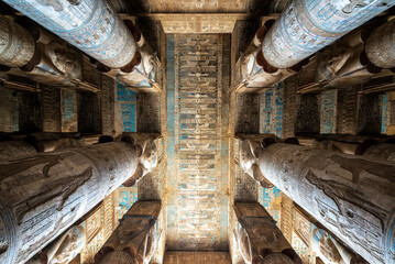 Looking up at the ornately decorated columns and ceiling of the Temple of Hathor in Dendera, Egypt - 753039103