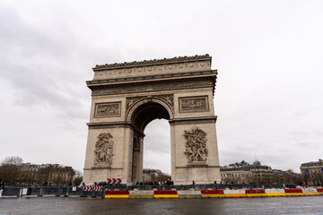 Fototapeta na wymiar The Arc de Triomphe is a large, white and gray arch with a red and yellow border